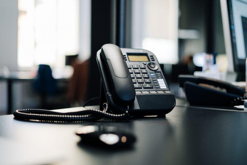Phone on a black desk.